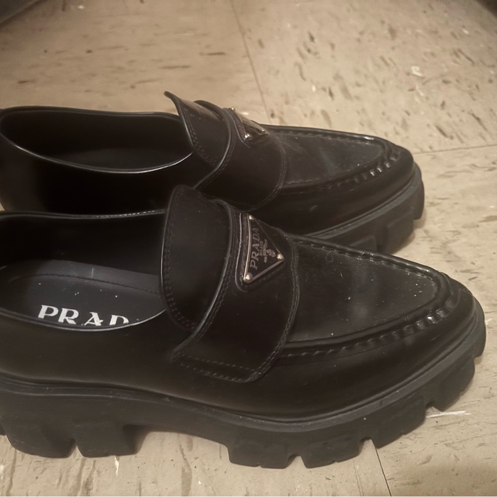 Prada women’s Glossy Black Slip-On Loafers